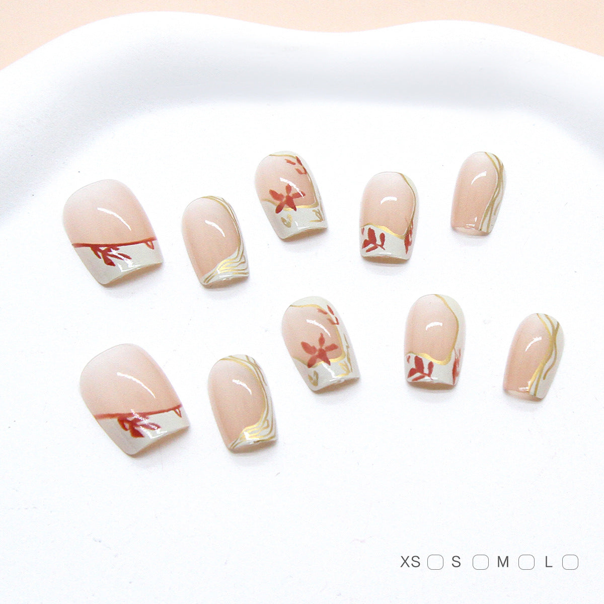 Set of nail art designs on a white tray with size indicators at the bottom.