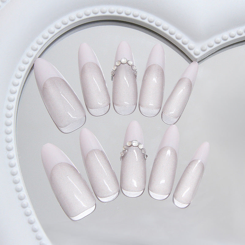 Elegant Dreamy Long Almond Shaped Press On Nail Set in Soft Pink with Iridescent Shine and Stunning Pearl Accent