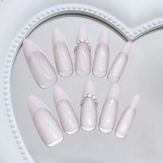 Elegant Dreamy Long Almond Shaped Press On Nail Set in Soft Pink with Iridescent Shine and Stunning Pearl Accent