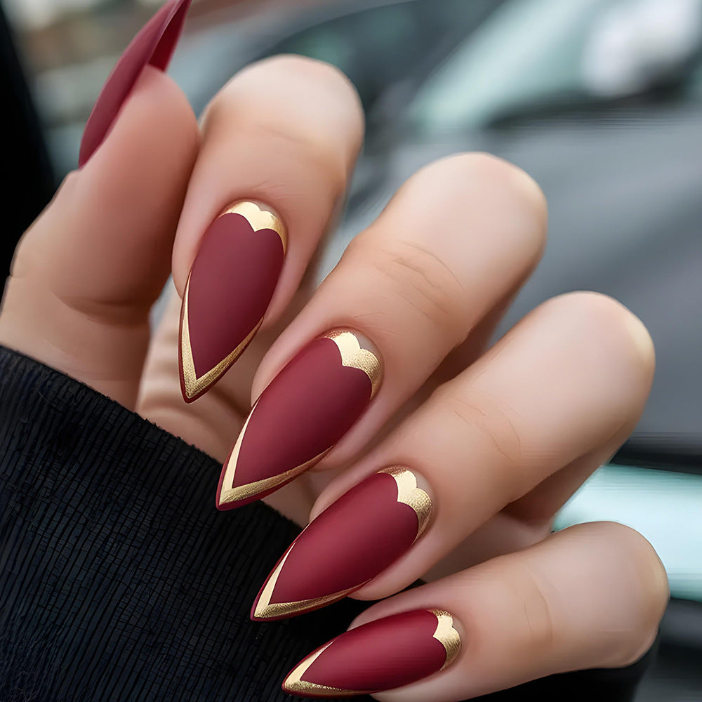 Romantic Elegance Long Almond Burgundy Nails with Gold Heart Tips