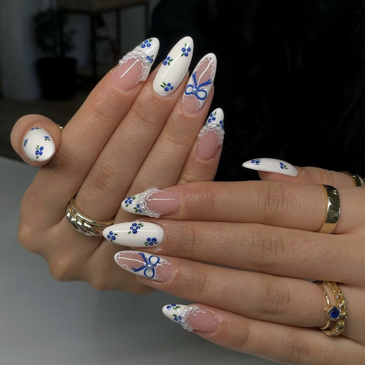 Charming Floral Design Long Oval White Press On Nail Set with Intricate Blue Accents