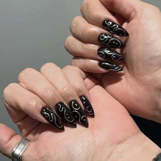 Mystical Elegance Long Stiletto Black Nails with Unique White Swirl Design