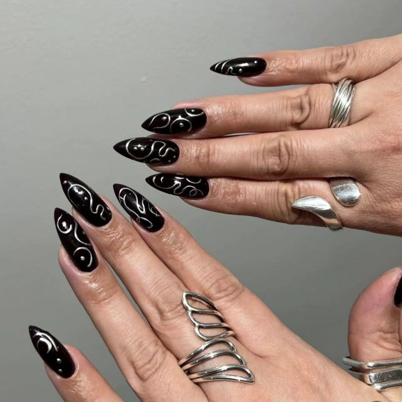Mystical Elegance Medium Stiletto Black Press On Nail Set with Unique White Swirl Design