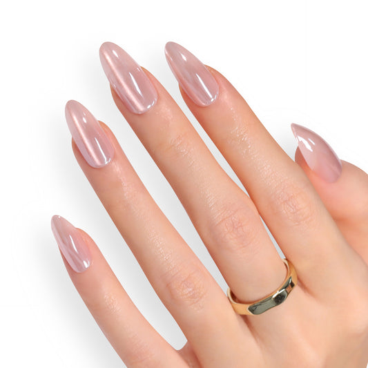 A hand with medium oval shape nails painted in a translucent pink color with a mirror shine finish.