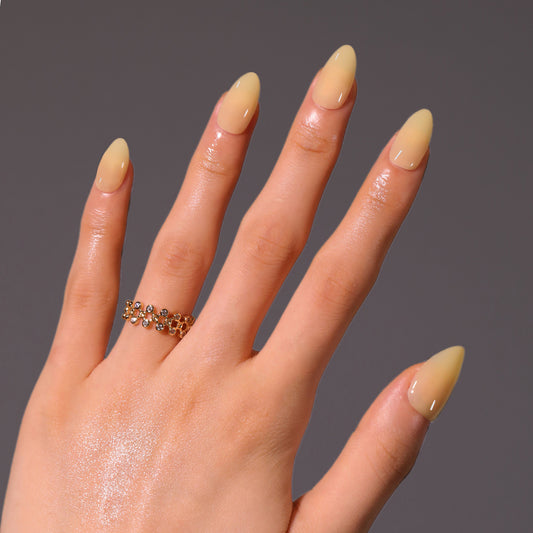 Chic Desert Dreams Medium Almond Shaped Soft Yellow Nail Set with Shimmering Gloss Finish
