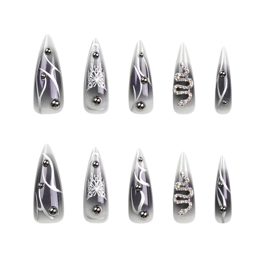 Mystical Elegance Long Stiletto Shiny Gray Decorative Nail Set with Unique Metallic Accents and Intricate Designs