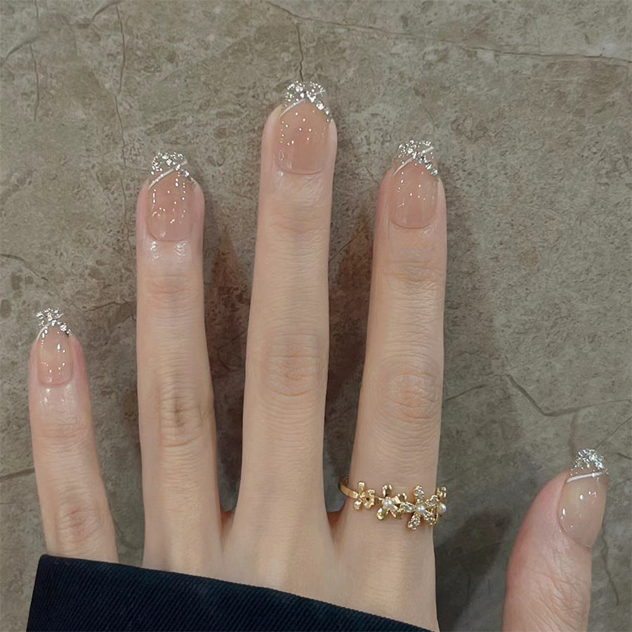 Hand with a gold ring on a stone surface