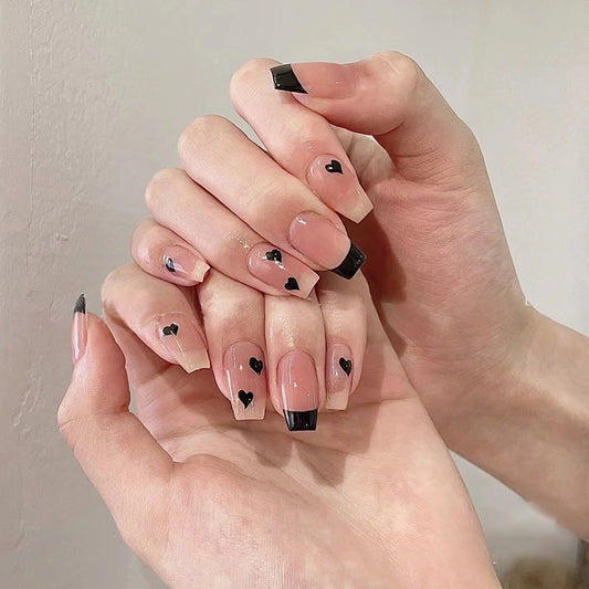Love Affair Extra-Long Coffin Press On Nails in Glossy beige with Black Tips and Heart Accents