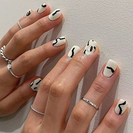 Abstract Art-Inspired Medium-Length Square White Press On Nails with Black Swirl Accents