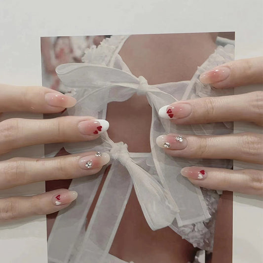 Elegant Romance Medium-Length Almond Pink Press On Nails with Heart Accents and Rhinestone Embellishments