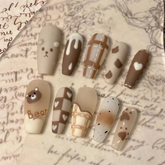 Cocoa Delight Medium Length Coffin Shaped Beige and Brown Press On Nail Set with Adorable Bear Accents and Heart Patterns