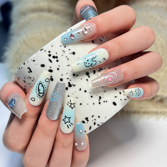 Celestial Whimsy Long Coffin Pastel Blue and Glitter Press On Nail Set with Rhinestone Accents and Artistic Designs