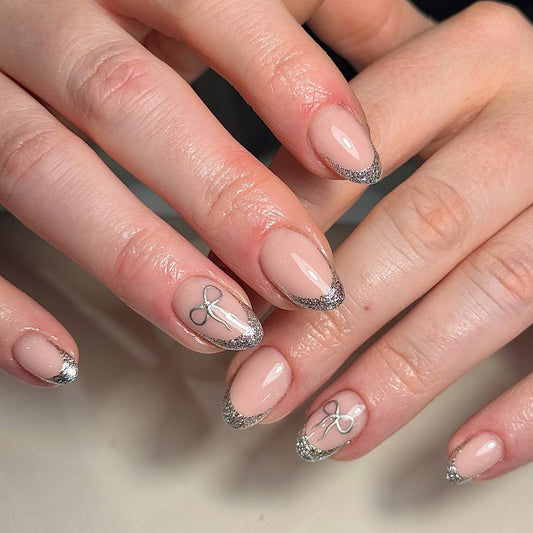 Charming Elegance Medium Almond Beige Glitter French Press On Nail Set with Dainty Bow Accents