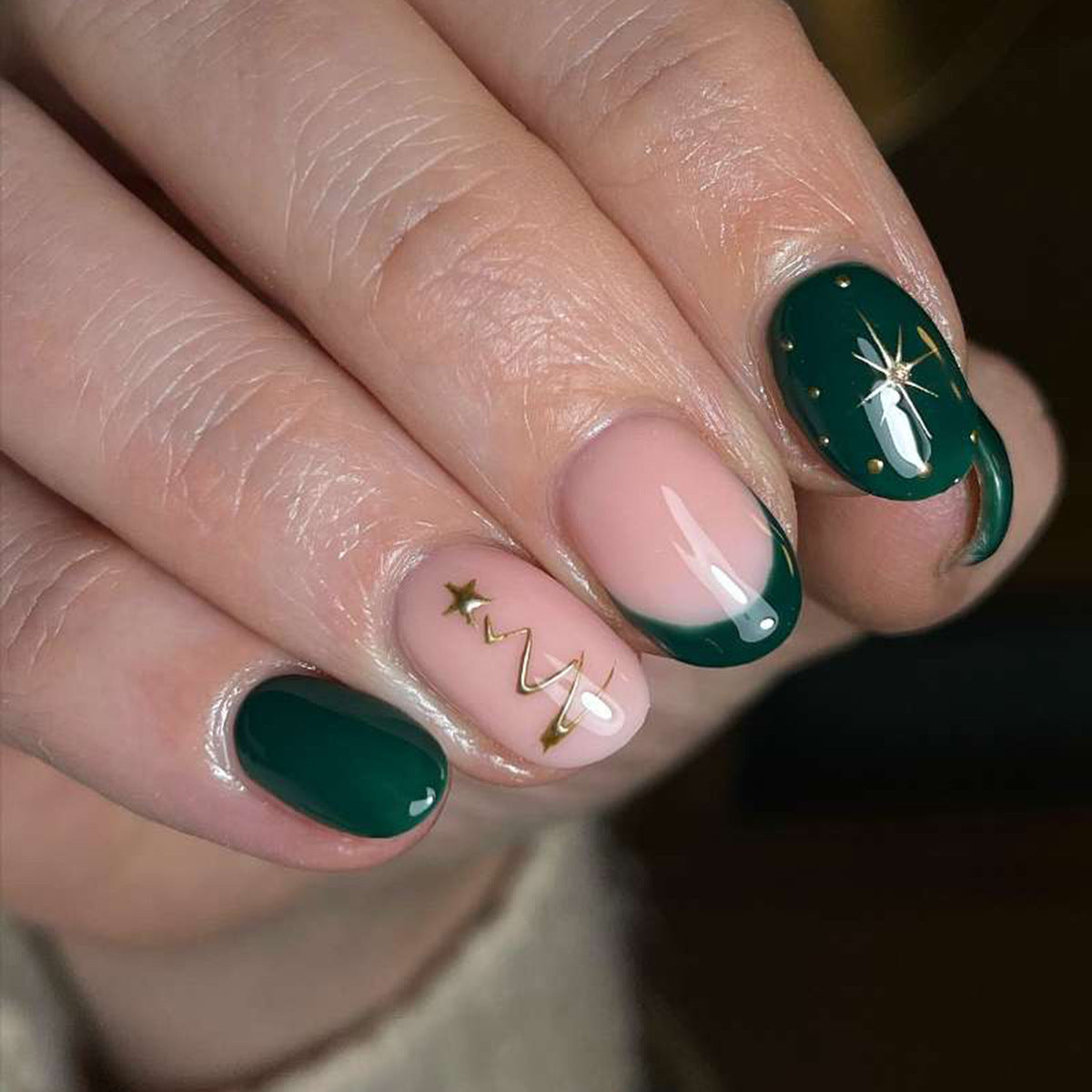 Festive Evergreen Medium Almond Press On Nail Set in Deep Green and Soft Pink with Unique Gold Star Accents