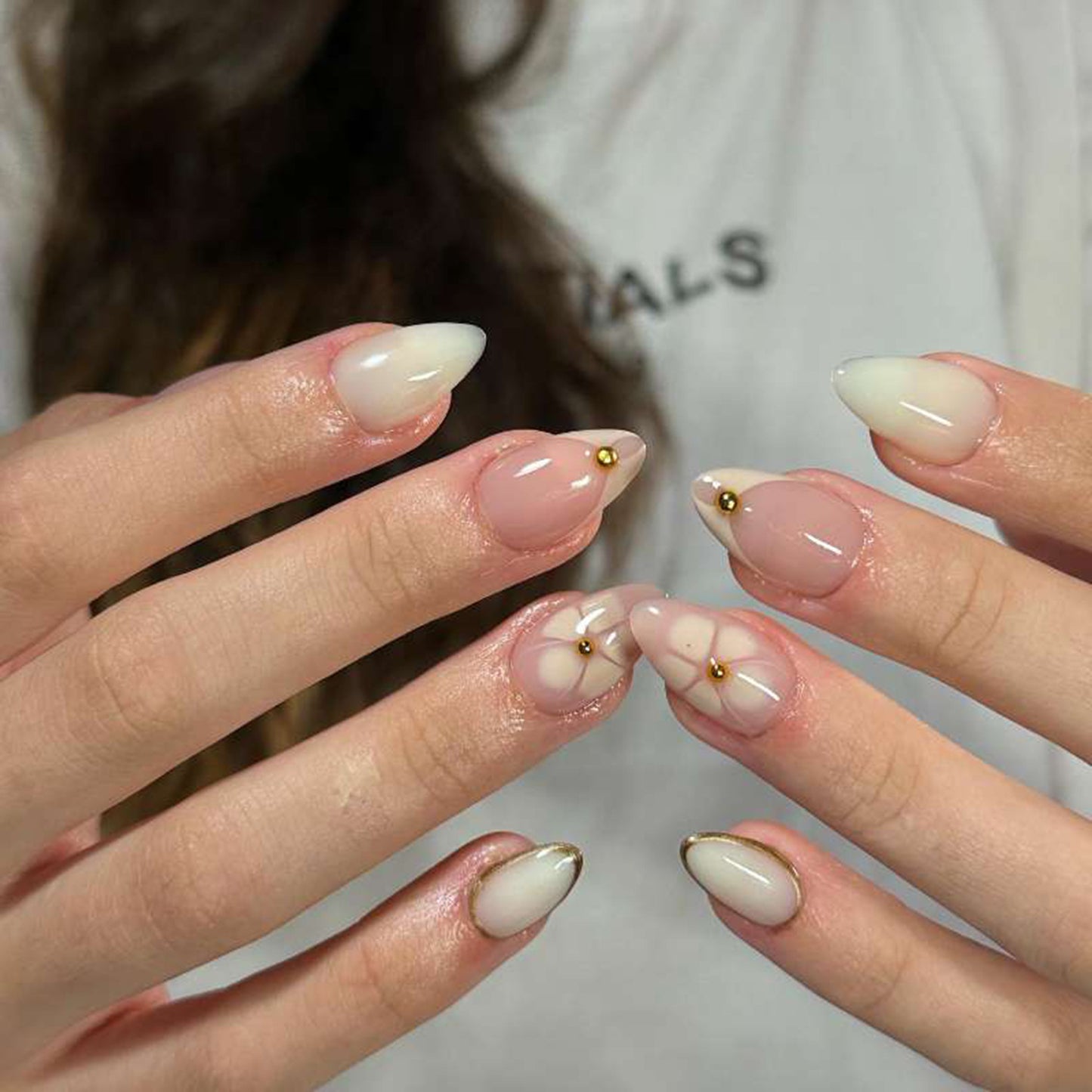Whimsical Floral Medium Almond Ivory Nails with Elegant Gold Accents
