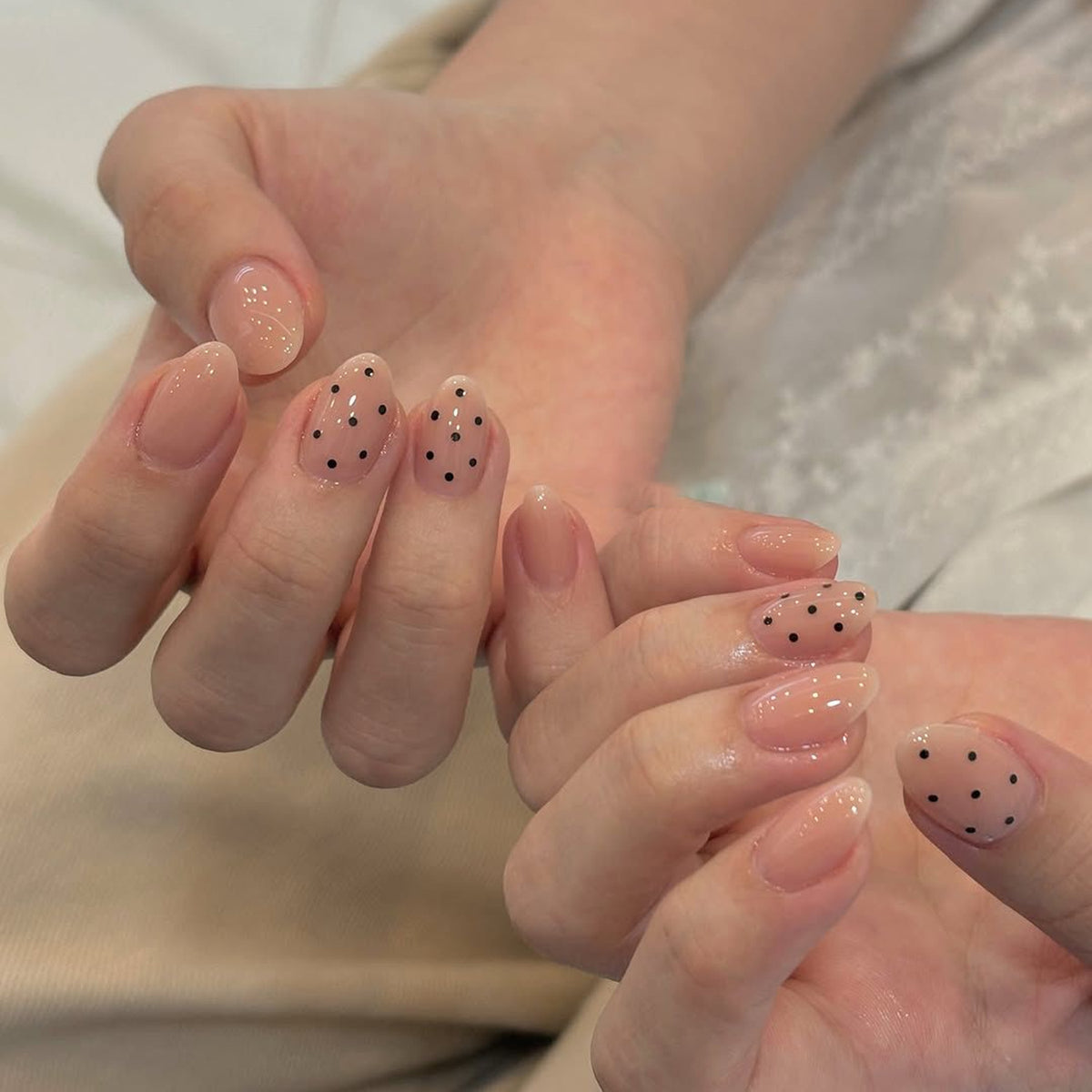 Chic Minimalist Medium Oval Beige Press On Nail Set with Polka Dot Accent