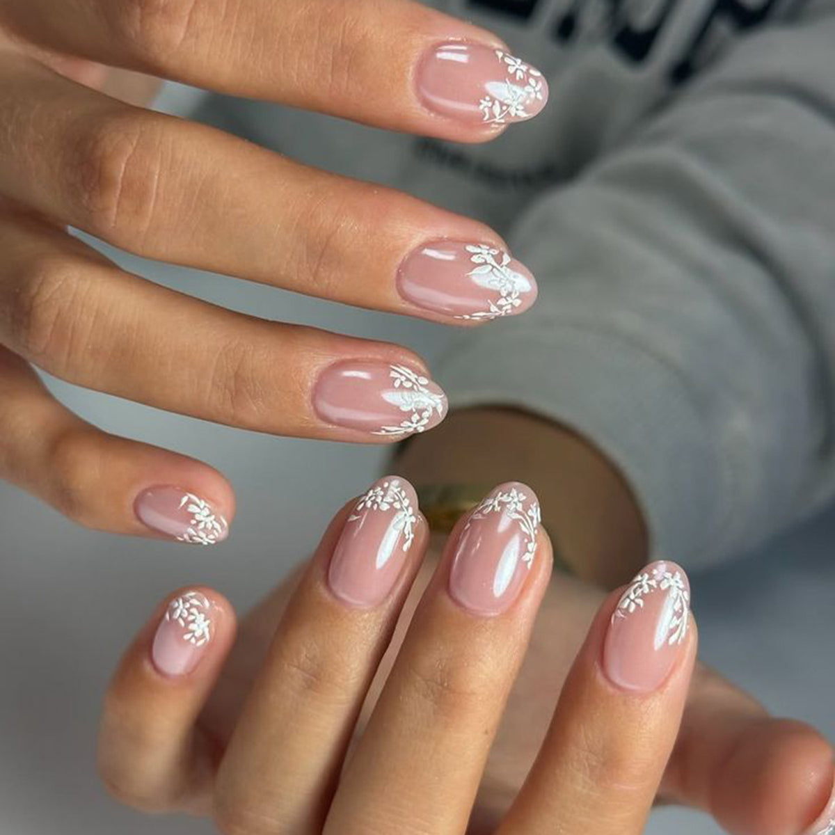 Whimsical Floral Design Medium Oval Pink Nail Set with Delicate White Accents