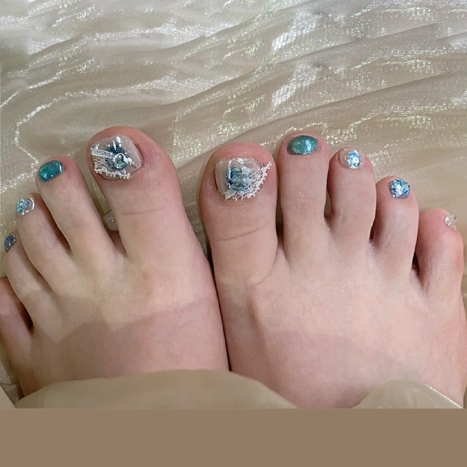Ocean Breeze Short Oval Press On Nail Set in Turquoise with Artistic Sea-Themed Designs and Glitter Accents