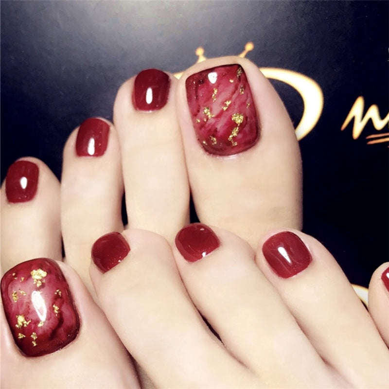 Glamorous Gala Burgundy Short Round Press-On Tonail Set with Gold Flakes Accents