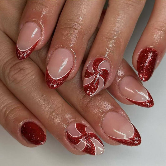 Festive Candy Cane Inspired Short Almond Shaped Red and Clear Glitter Ombre Nail Set with Whimsical Swirl Design