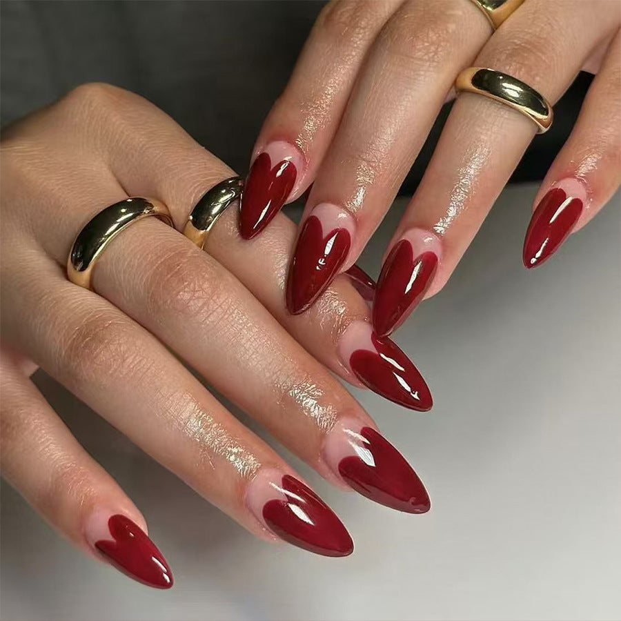 Romantic Elegance Medium Almond Shaped Deep Red Nail Set with Heart Design Feature