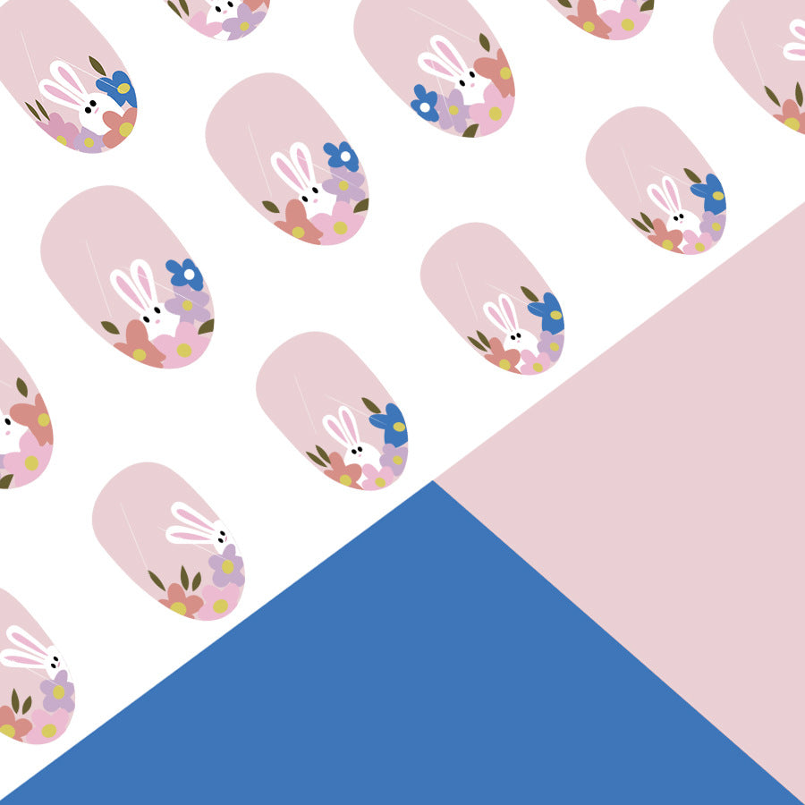 Pattern of nail art designs with bunnies and flowers on a pink and blue background