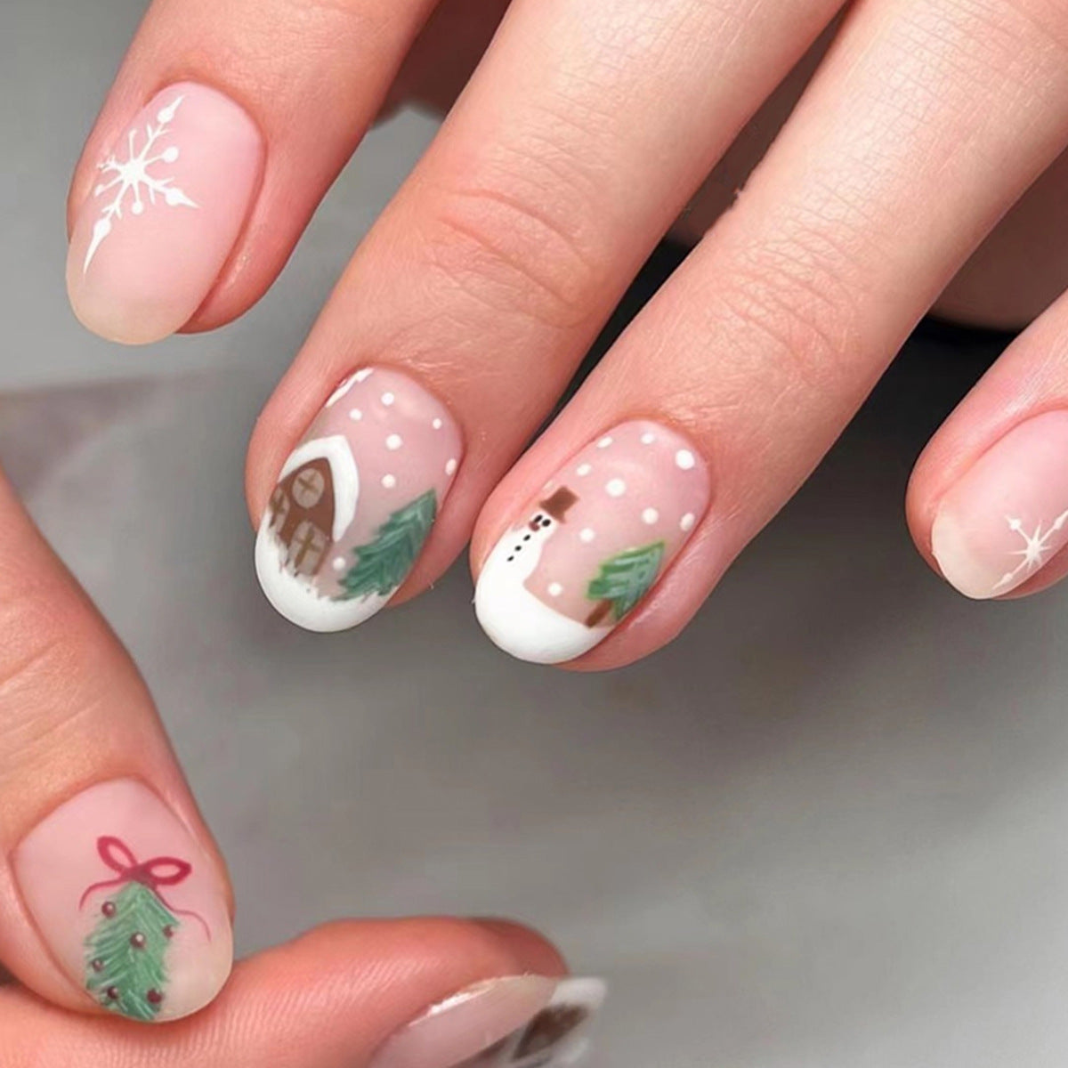 Winter Wonderland Medium Oval Light Pink Press On Nail Set with Festive Hand-Painted Holiday Designs