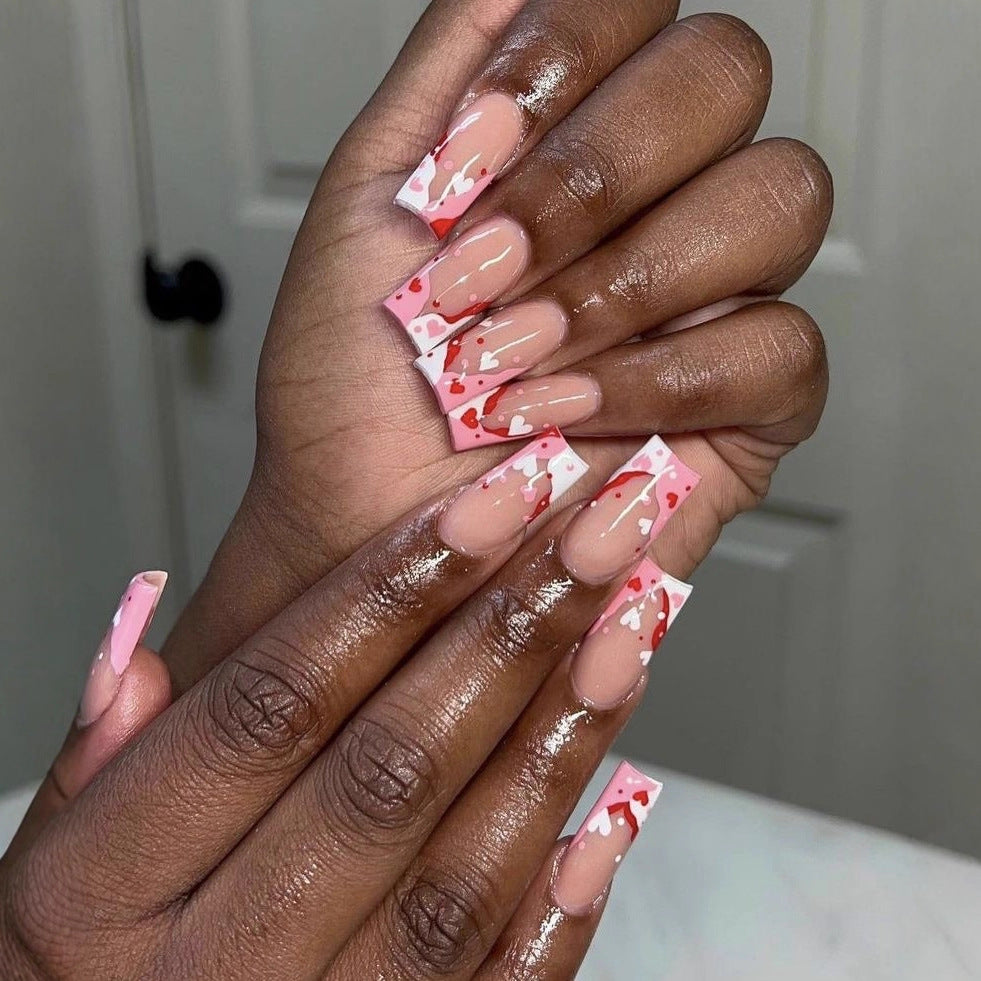 Love-Inspired Long Square Pink Nails with Heart Detailing