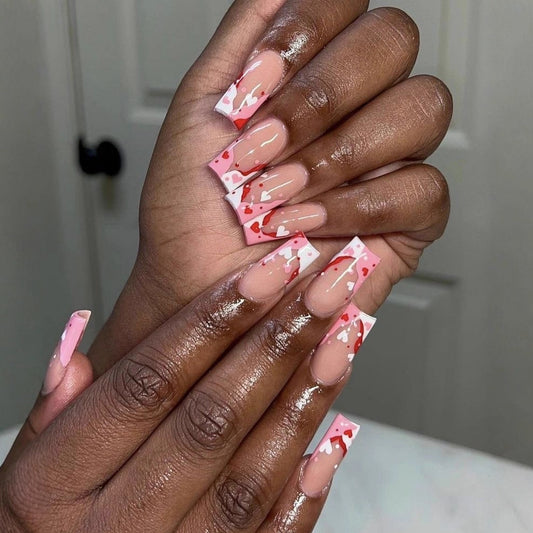 Love-Inspired Long Square Pink Nails with Heart Detailing