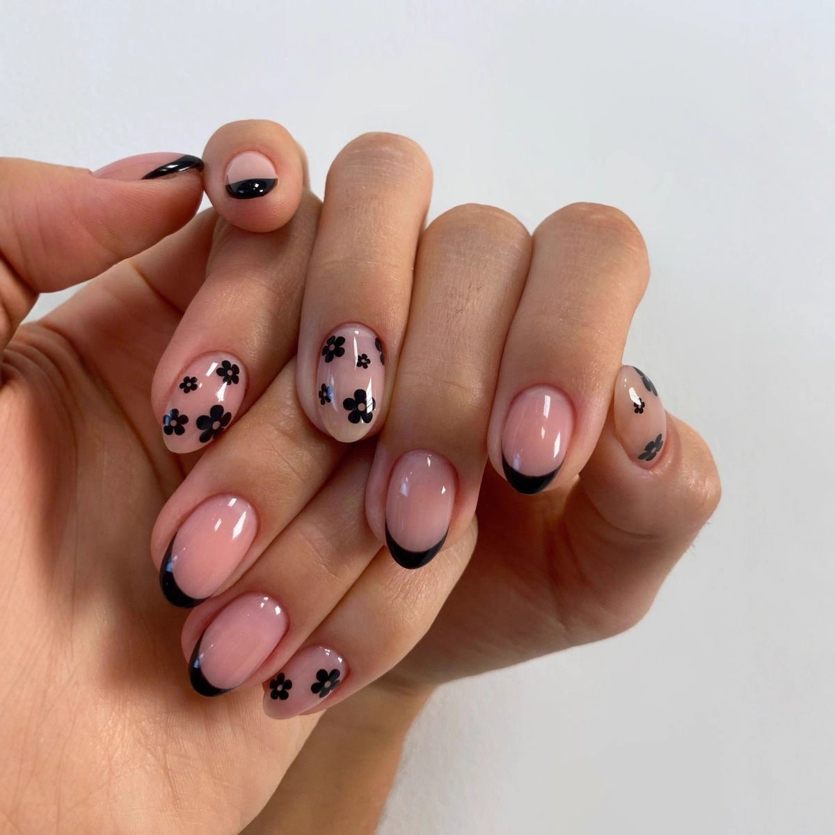 Floral Elegance Medium Oval Soft Pink with Black French Tips and Charming Floral Accents Press On Nail Set