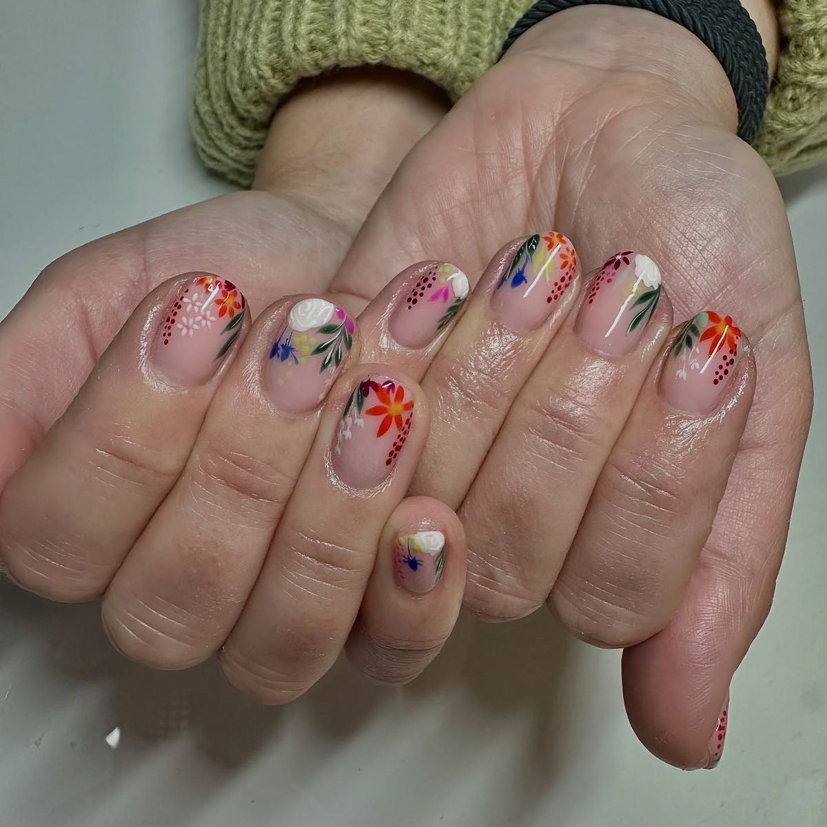 Botanical Bliss Short Oval Clear Floral Press On Nail Set with Vibrant Nature-Inspired Art
