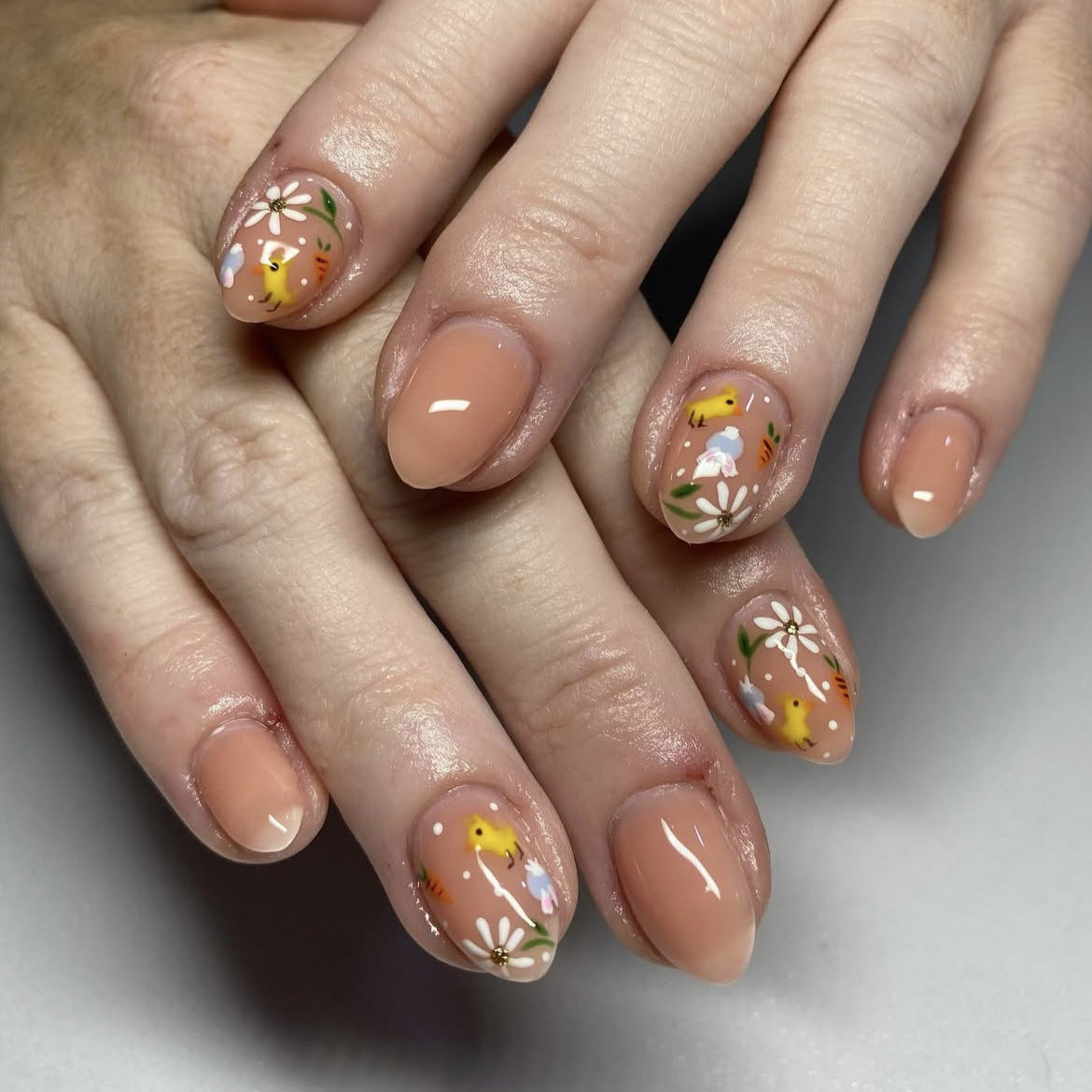 Whimsical Blossom Short Almond Peach Press On Nail Set with Floral Design