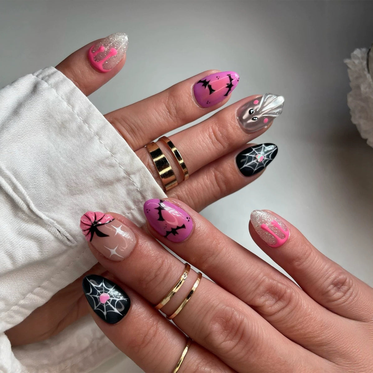 Spooky Charm Short Stiletto Pink and Black Press On Nail Set with Glitter Accents