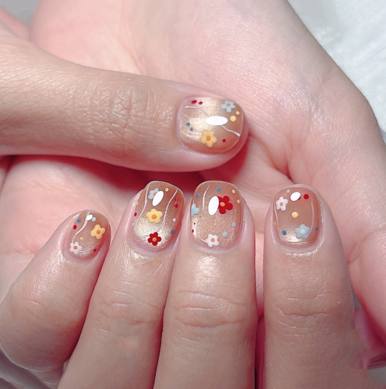 Floral Delight Short Round Peachy Background with Whimsical Flower Decals Press On Nail Set