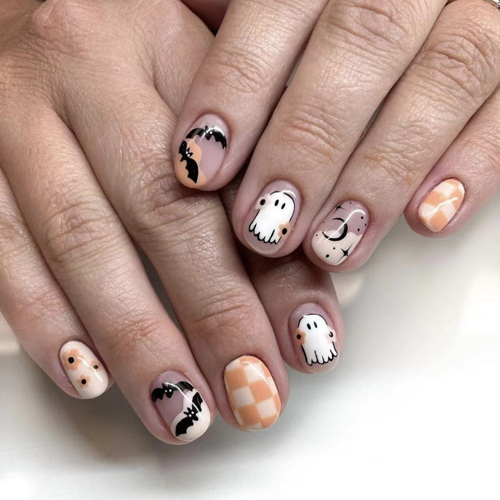 Spooky Elegance Short-Length Oval Peach Press On Nails with Cute Ghost and Bat Designs
