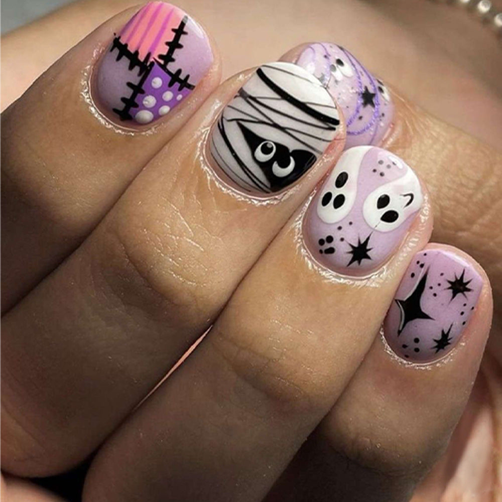 Spooky Elegance Short-Length Oval Press On Nails in Purple and Black with Cartoon Ghost Designs