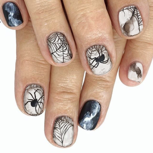 Spooky Elegance Short Oval Black and White Spiderweb Press On Nail Set with Marbled Accents