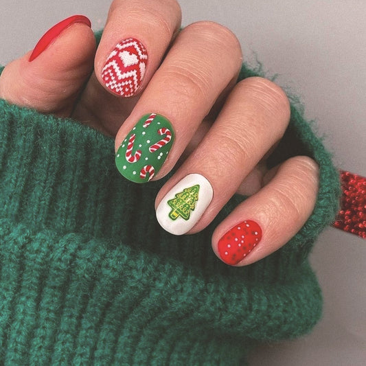 Festive Wonderland Medium Oval Red Green and White Christmas Themed Press On Nail Set with Candy Cane and Christmas Tree Designs