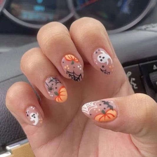 Spooktacular Almond Shaped Medium Length Beige Press On Nail Set with Halloween Ghosts and Pumpkins Design