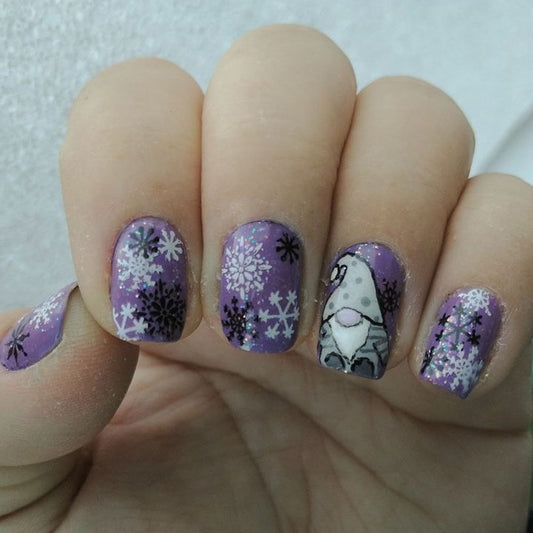 Whimsical Winter Wonderland Medium Squoval Lavender Nails with Fun Snowflake and Gnome Design