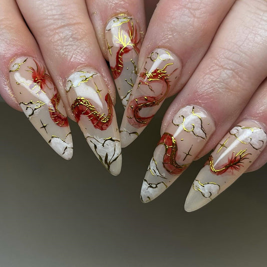 Enchanting Elegance Extra-Long Stiletto Cream Press On Nail Set with Gold Foil Accents and Distinctive Marble Design