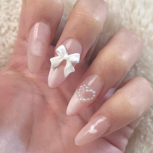 Charming Elegance Long Almond Pink Press On Nail Set with Lovely Bow and Heart Accents