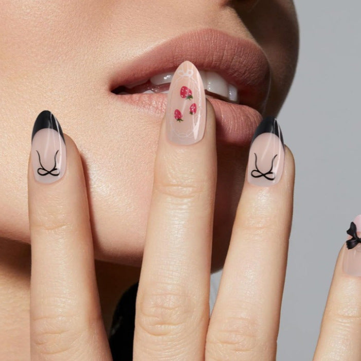 Chic Floral Delight Medium Almond Pink with Black Tips and Whimsical Bow Accent Press on Nail Set