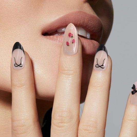 Chic Floral Delight Medium Almond Pink with Black Tips and Whimsical Bow Accent Press on Nail Set