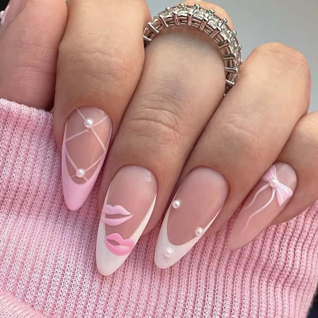 Chic Whimsy Long Almond Pink Artistic Nail Set with Unique Pearl Accents