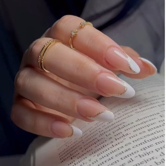 Elegant French Tip Design Long Almond Press On Nail Set in Glossy Clear and White with Dazzling Gold Glitter Accents