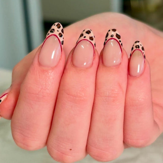 Fierce Jungle Fantasy Short Almond Beige Nails with Leopard Print Tips and Red Accent Line