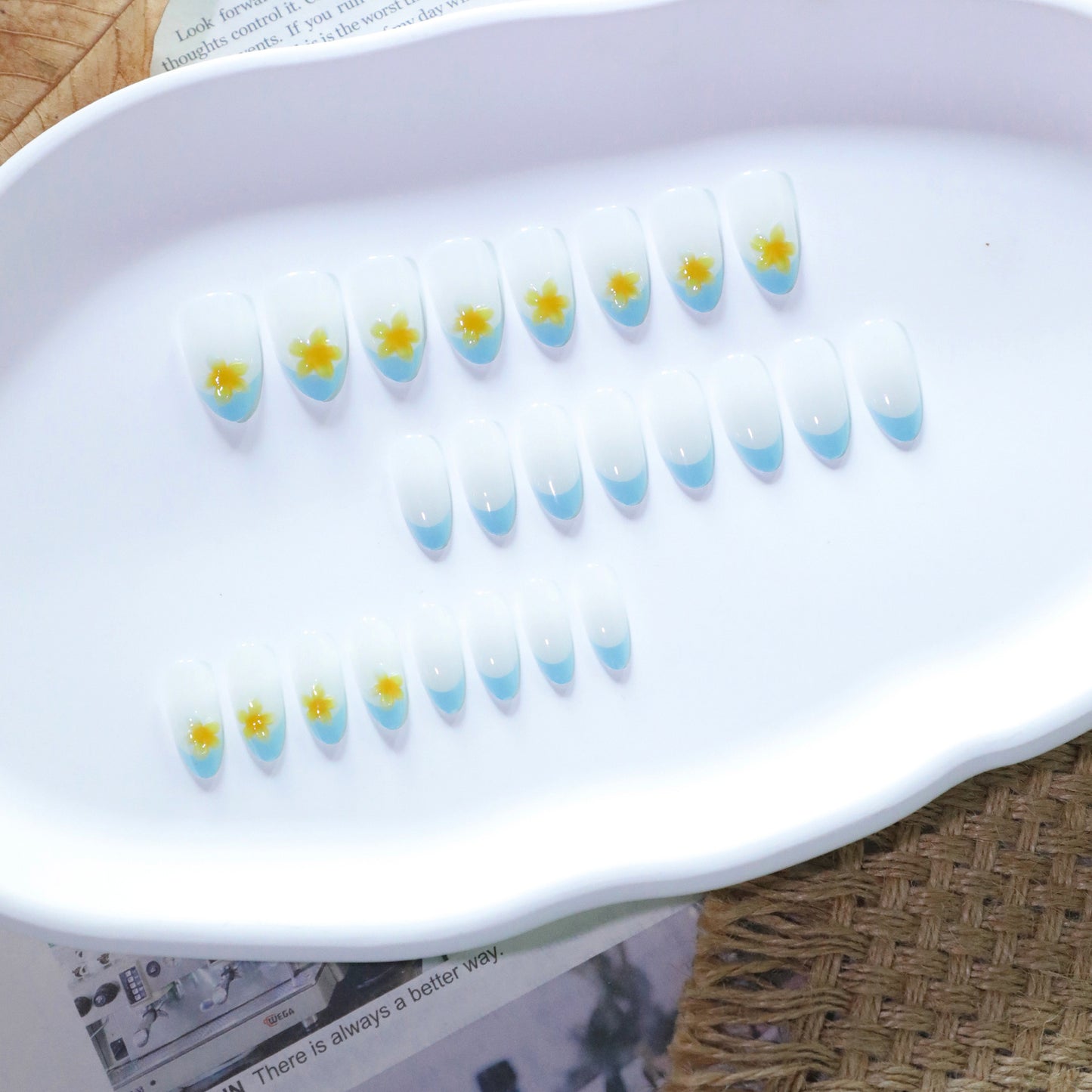 Whimsical Floral Design Medium Almond Shape White with Blue Tips and Delightful Yellow Flower Accents Press On Nail Set