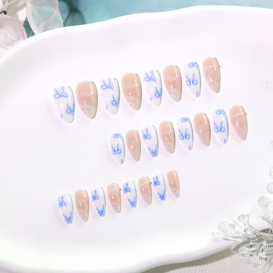Whimsical Garden Medium Almond White and Beige Press On Nail Set with Intricate Blue Floral Design