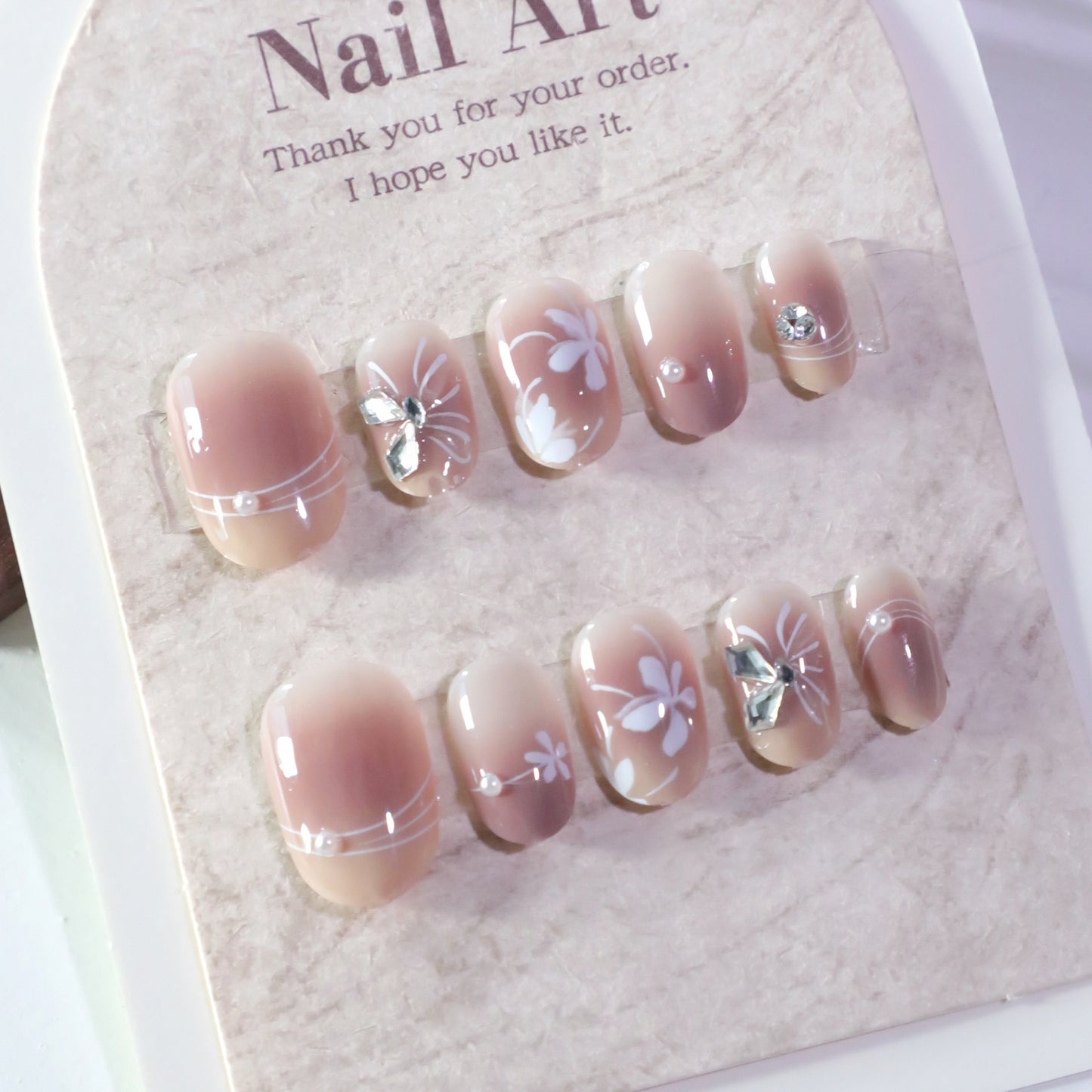 Chic Garden Delight Short Oval Blush Pink Nail Set with Floral and Gemstone Accents